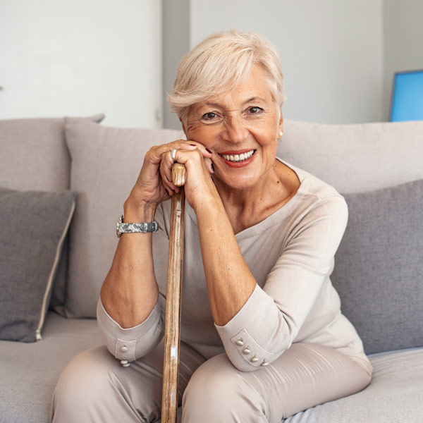 woman with cane smiling